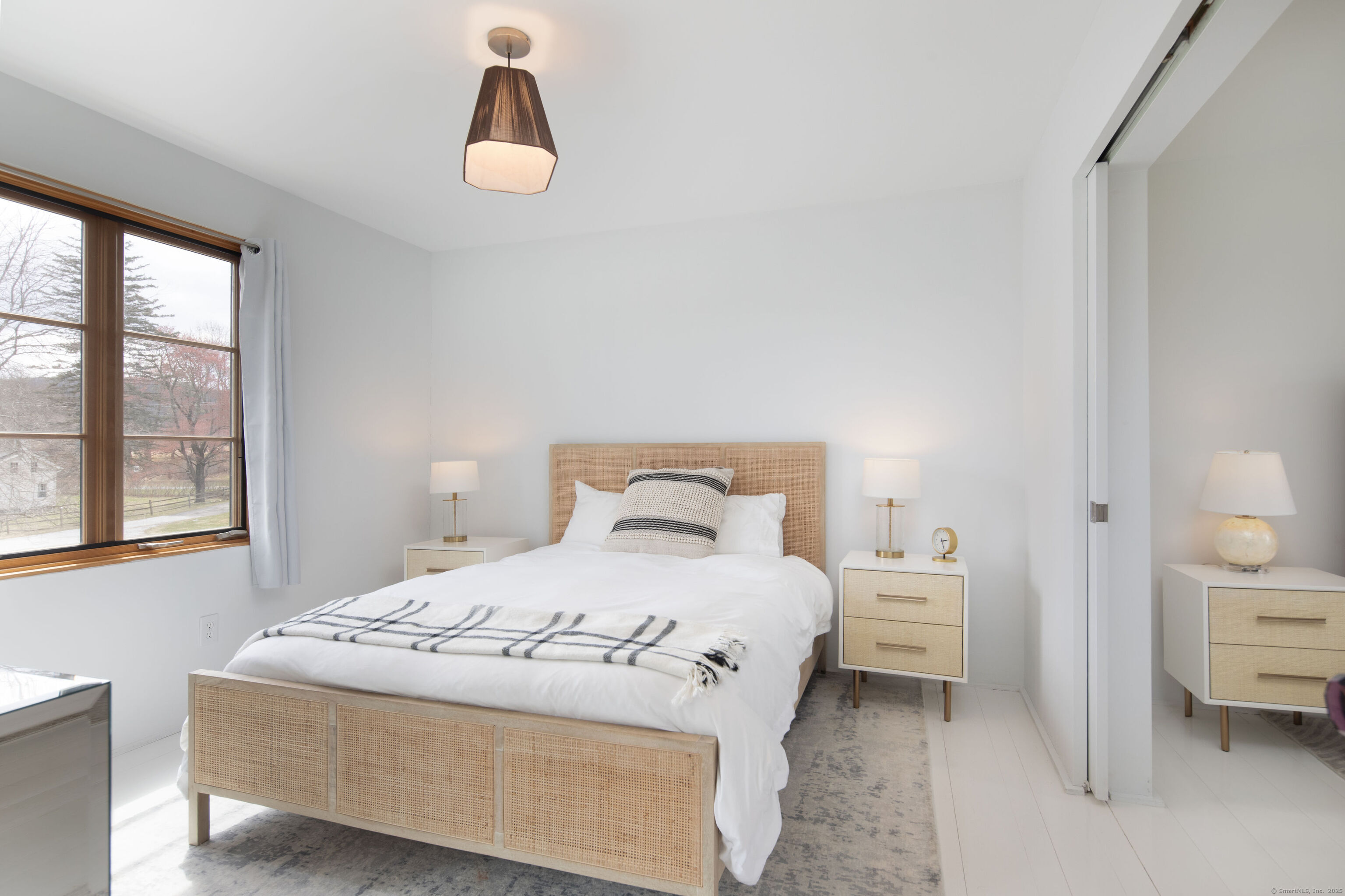 120 Lime Rock Road Salisbury, CT 06039 - Photo 23 of 35 a bedroom with a bed and a window