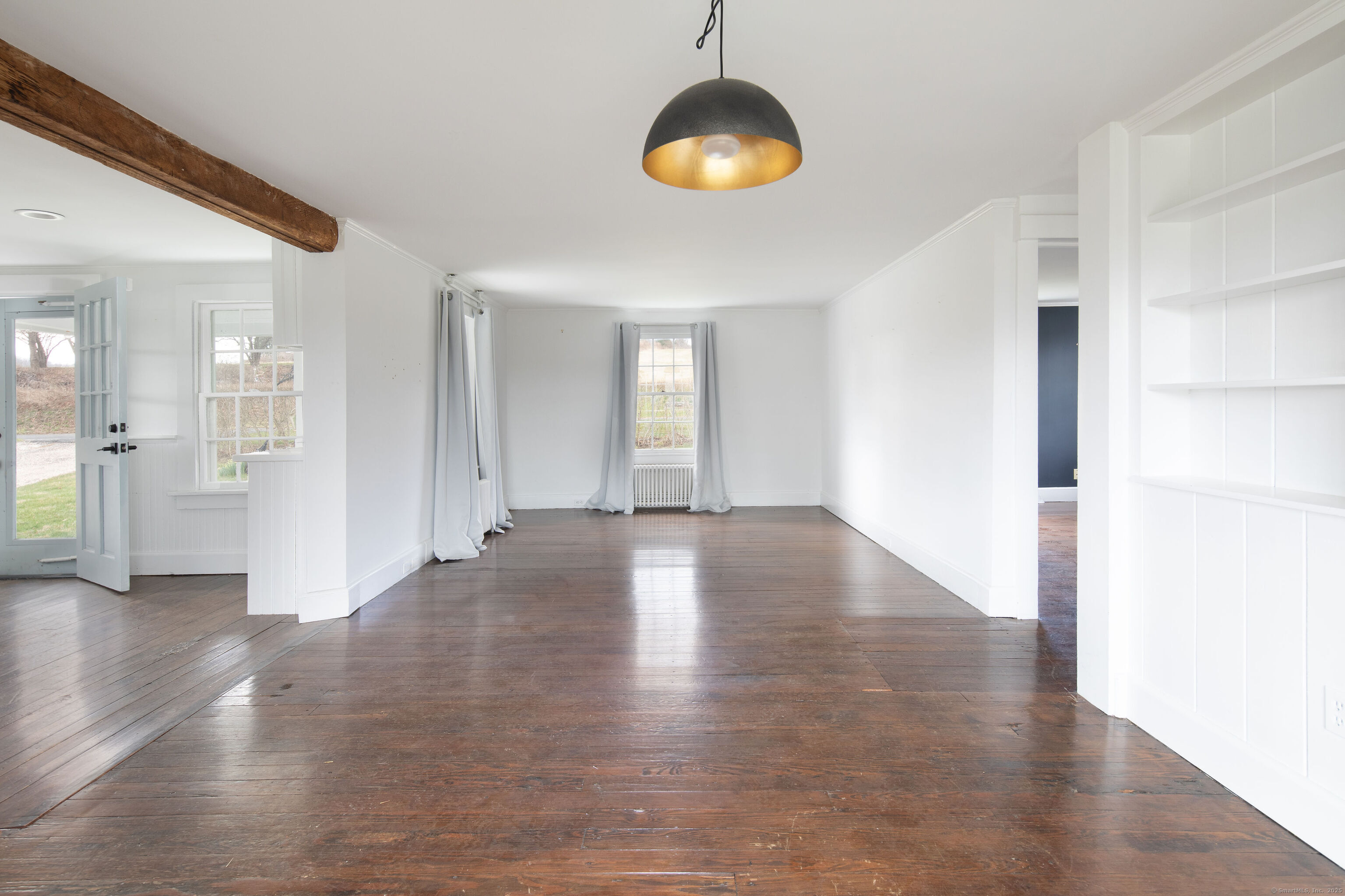 120 Lime Rock Road Salisbury, CT 06039 - Photo 33 of 35 a view of an empty room with wooden floor and a window