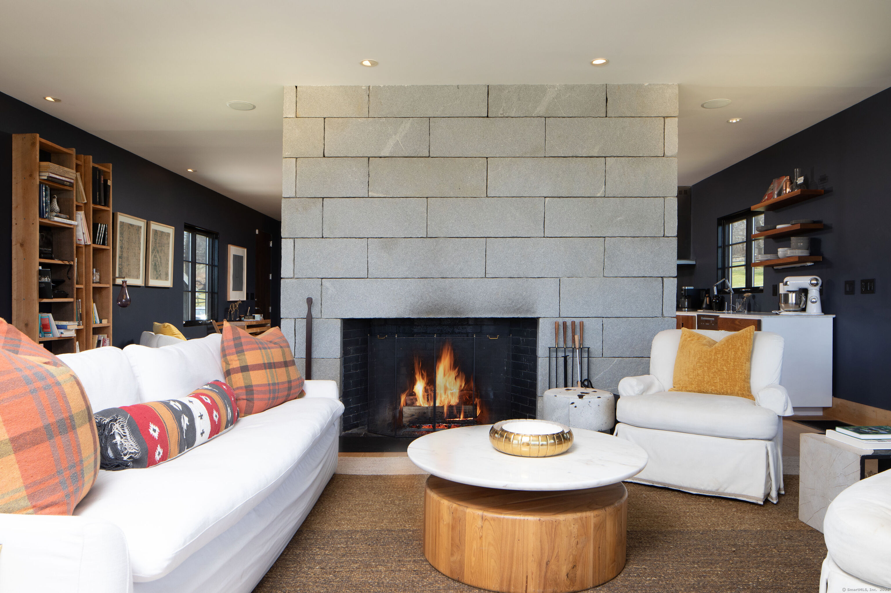 120 Lime Rock Road Salisbury, CT 06039 - Photo 4 of 35 a living room with furniture and a fireplace
