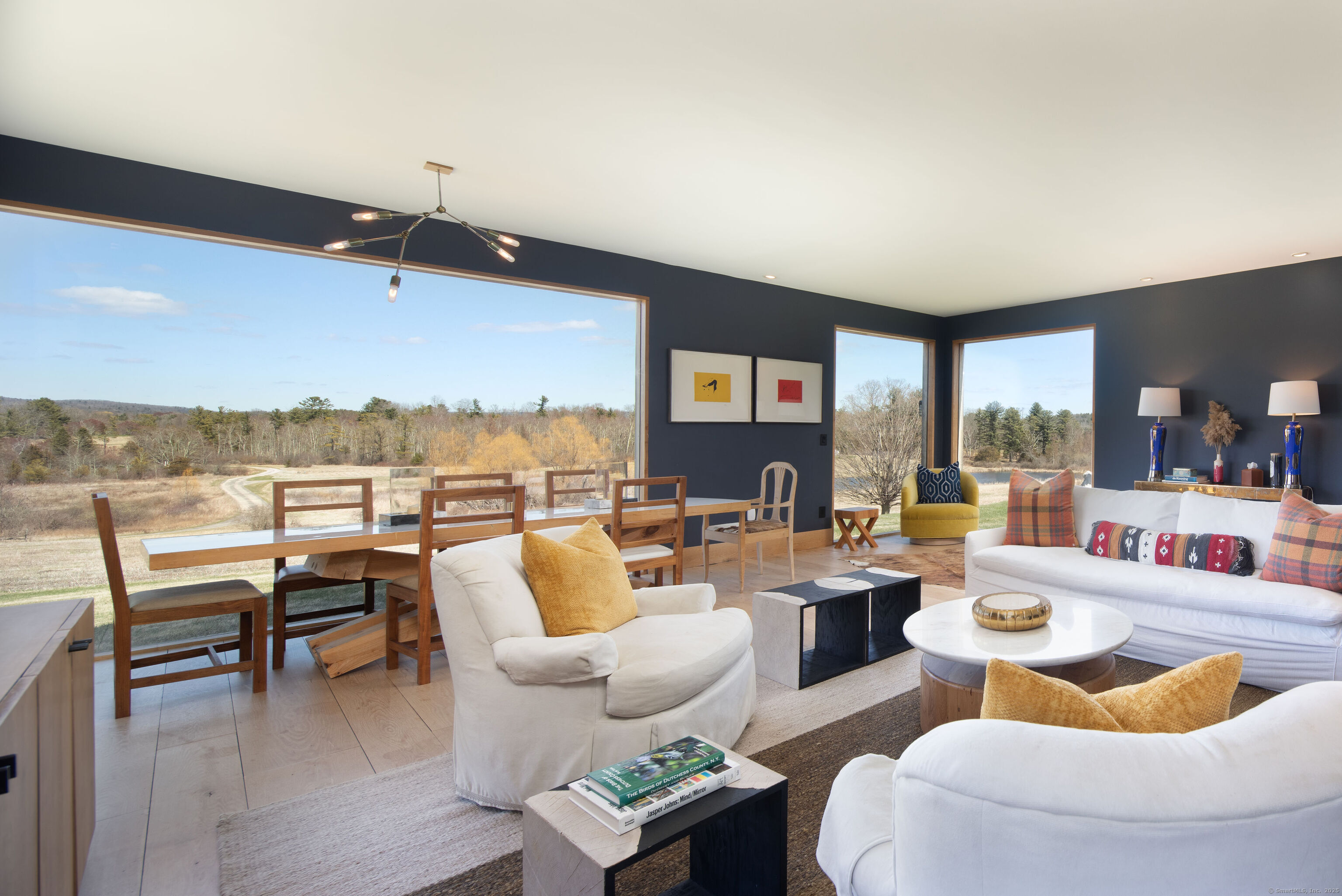 120 Lime Rock Road Salisbury, CT 06039 - Photo 6 of 35 a living room with furniture and a floor to ceiling window