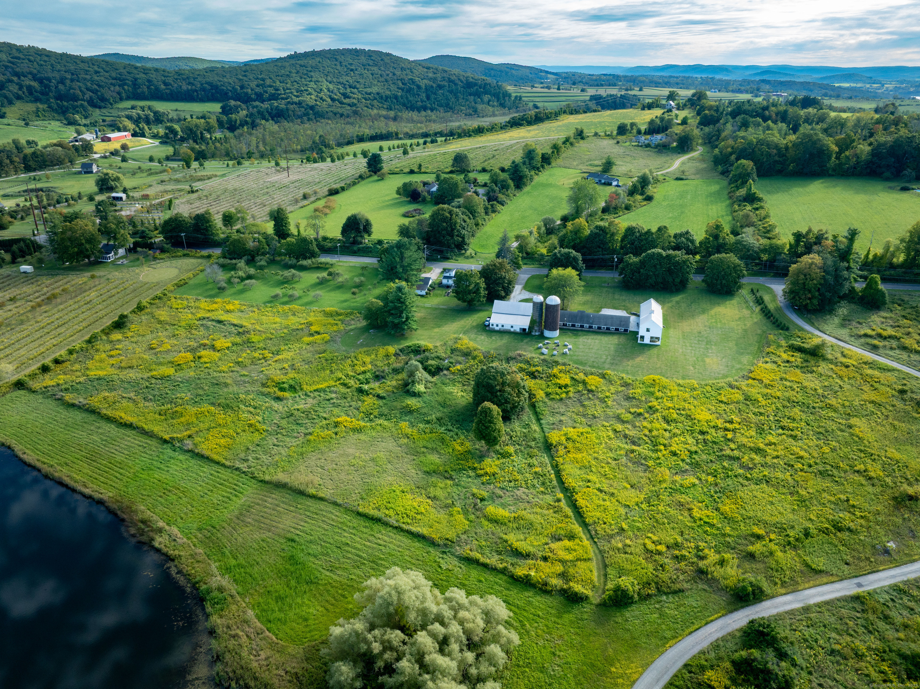 120 Lime Rock Road Salisbury, CT 06039 - Photo 9 of 35 a view of a lake with a yard