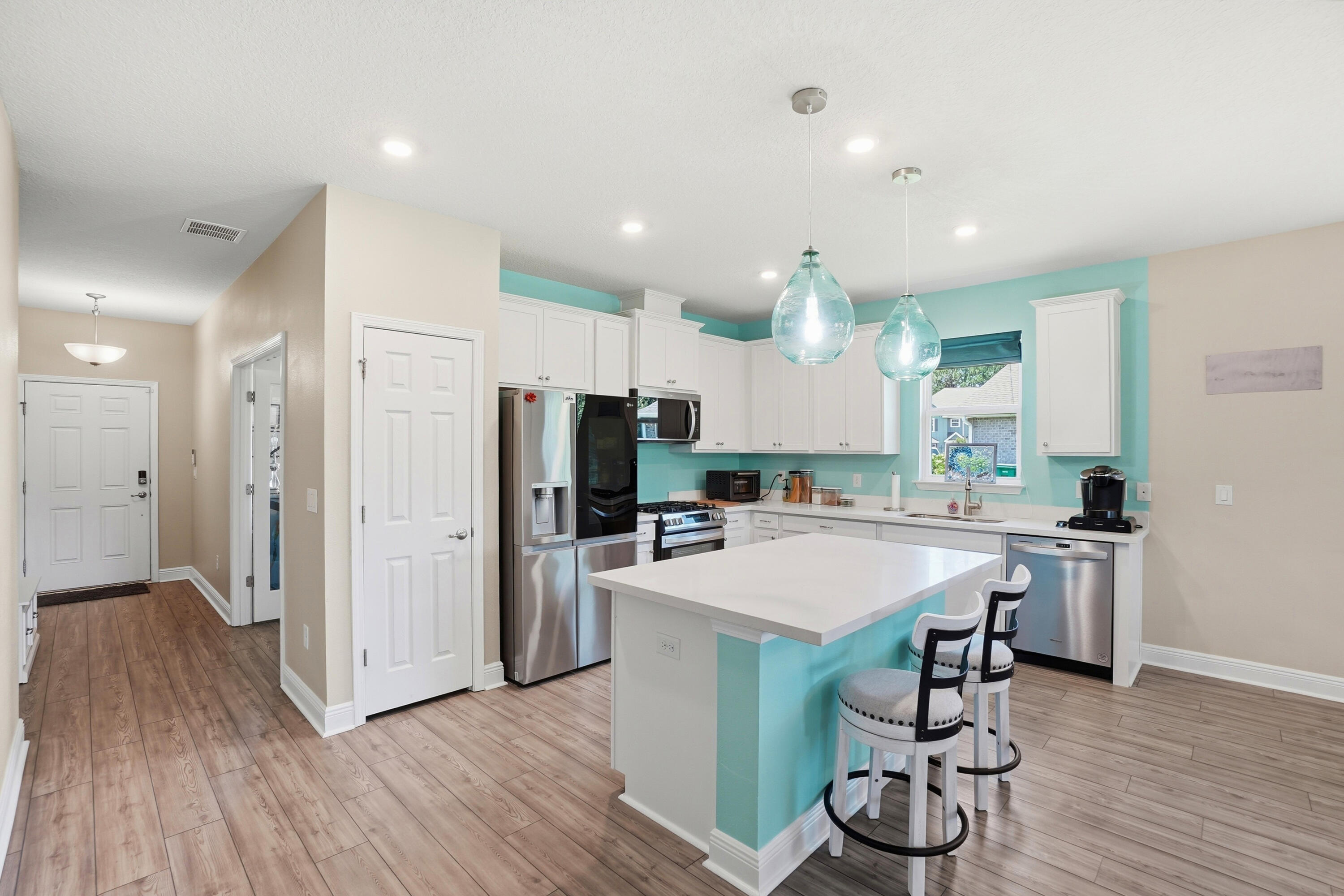 525 Windchime Way Freeport, FL 32439 - Photo 6 of 59 a large kitchen with a table and chairs