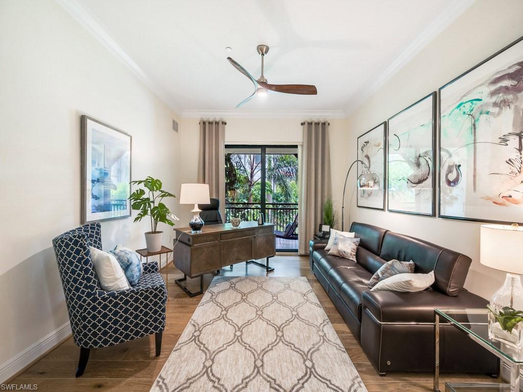 16425 Carrara Way, Unit 101 Naples, FL 34110 - Photo 14 of 21 a living room with furniture and a large window