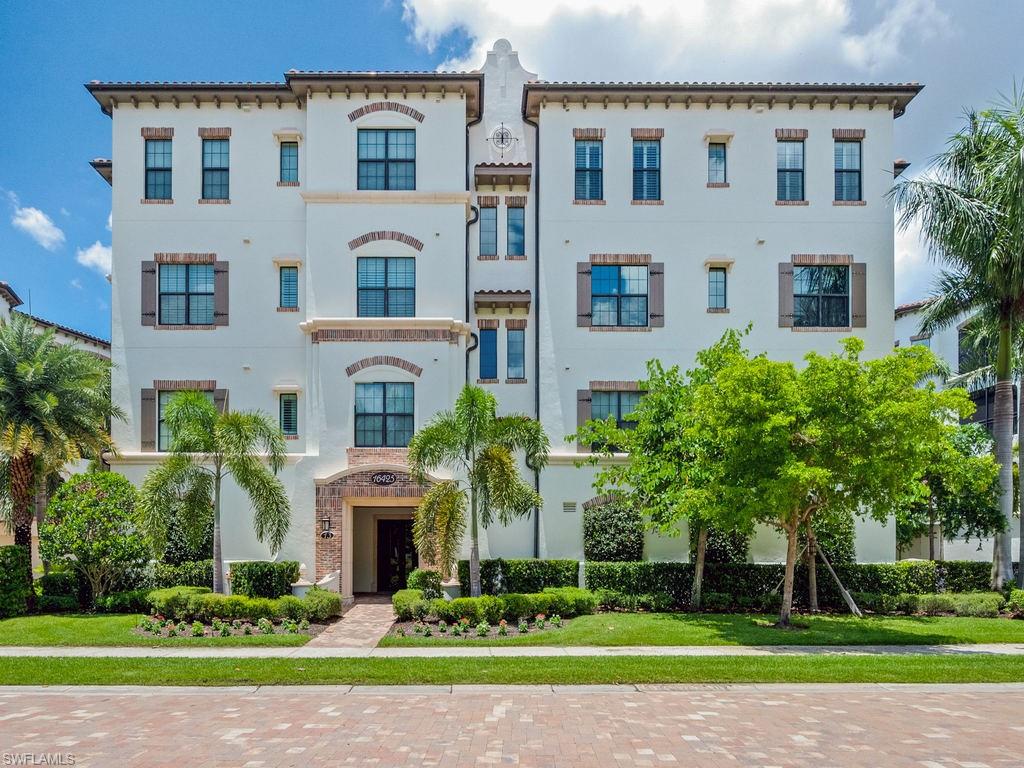 16425 Carrara Way, Unit 101 Naples, FL 34110 - Photo 8 of 21 a front view of house with yard and green space