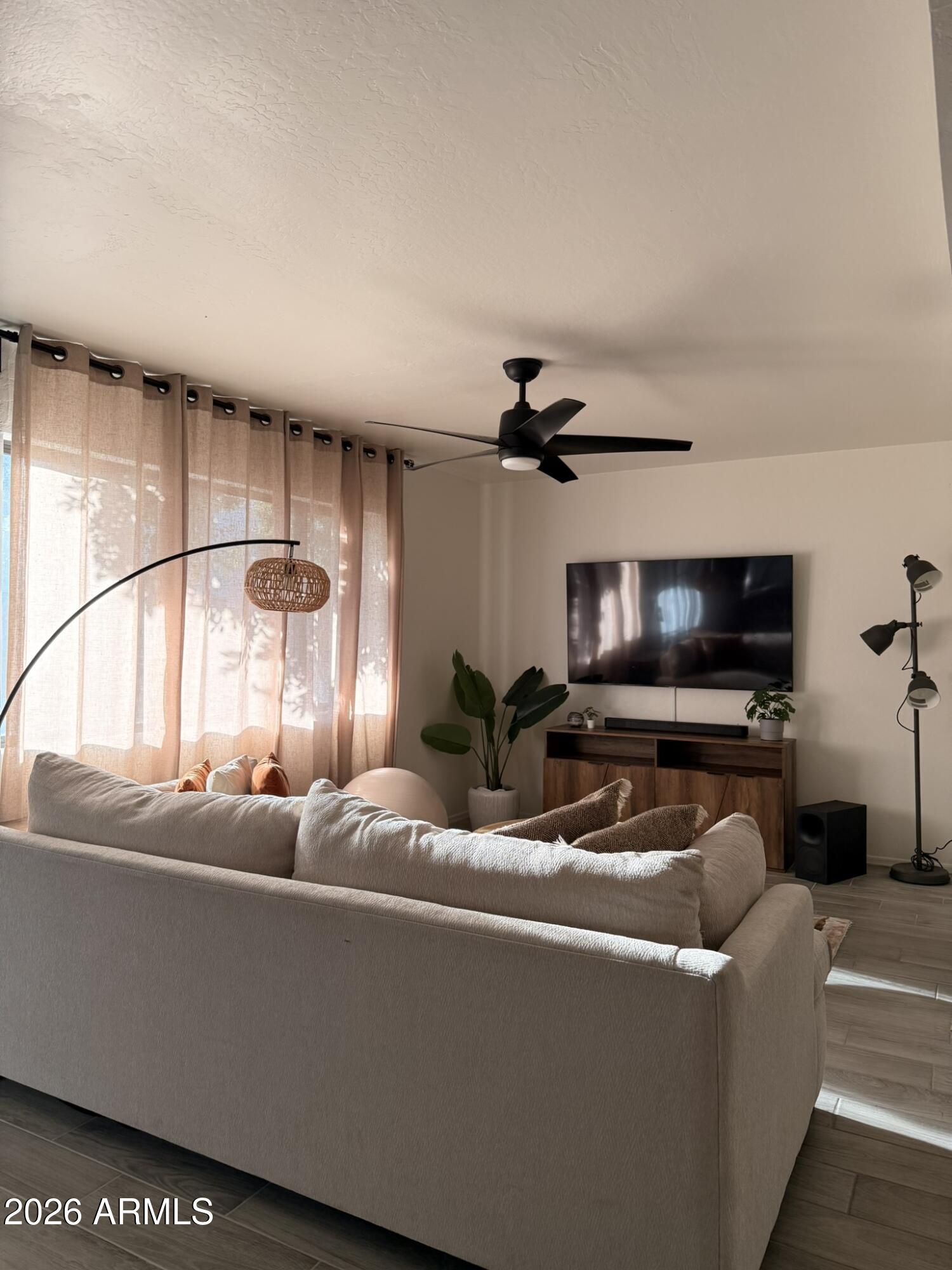 2554 West Kathleen Road Phoenix, AZ 85023 - Photo 6 of 22 a living room with furniture and a flat screen tv