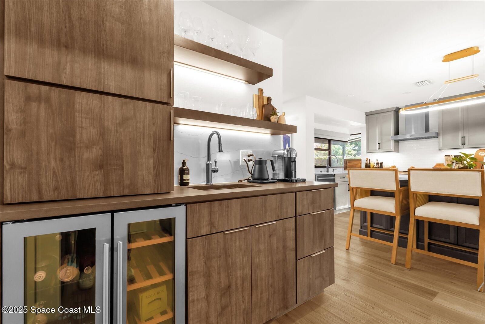 3204 Nottingham Lane Cocoa, FL 32926 - Photo 12 of 36 a kitchen with stainless steel appliances granite countertop a refrigerator and cabinets