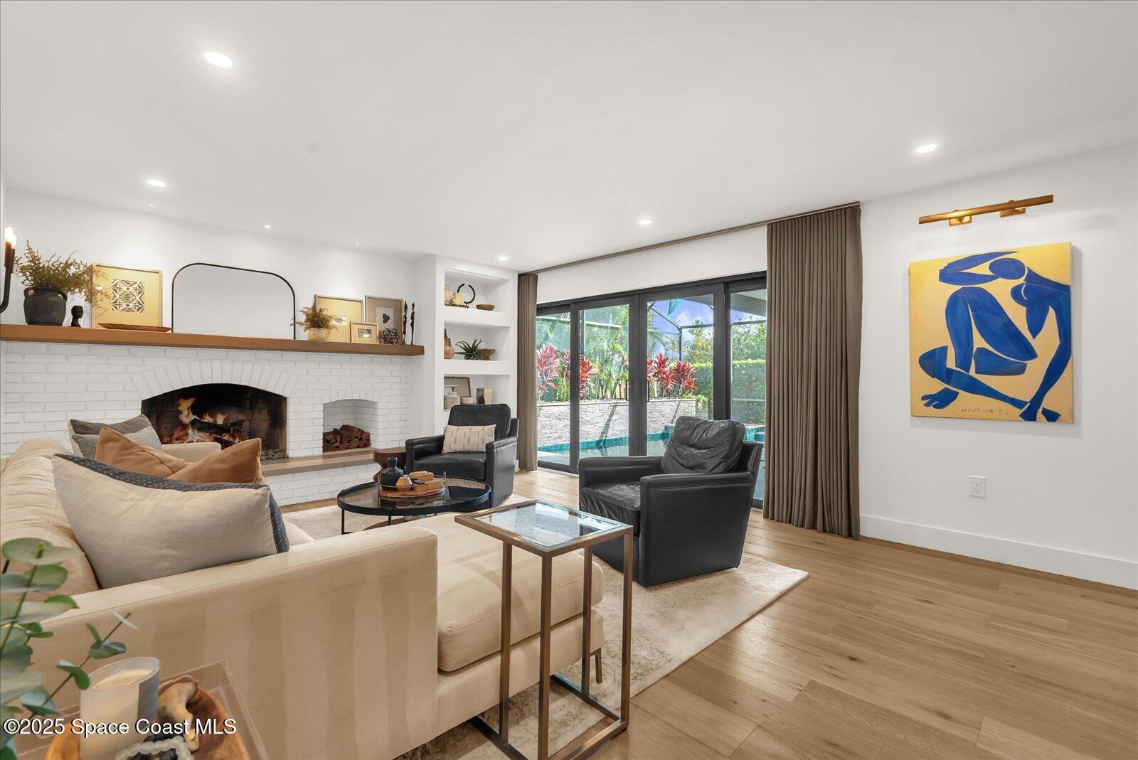 3204 Nottingham Lane Cocoa, FL 32926 - Photo 14 of 36 a living room with furniture and a fireplace