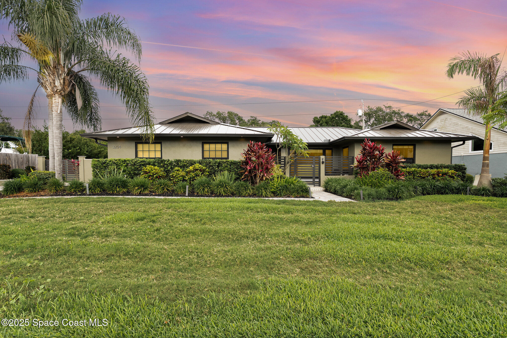3204 Nottingham Lane Cocoa, FL 32926 - Photo 32 of 36 a front view of a house with garden