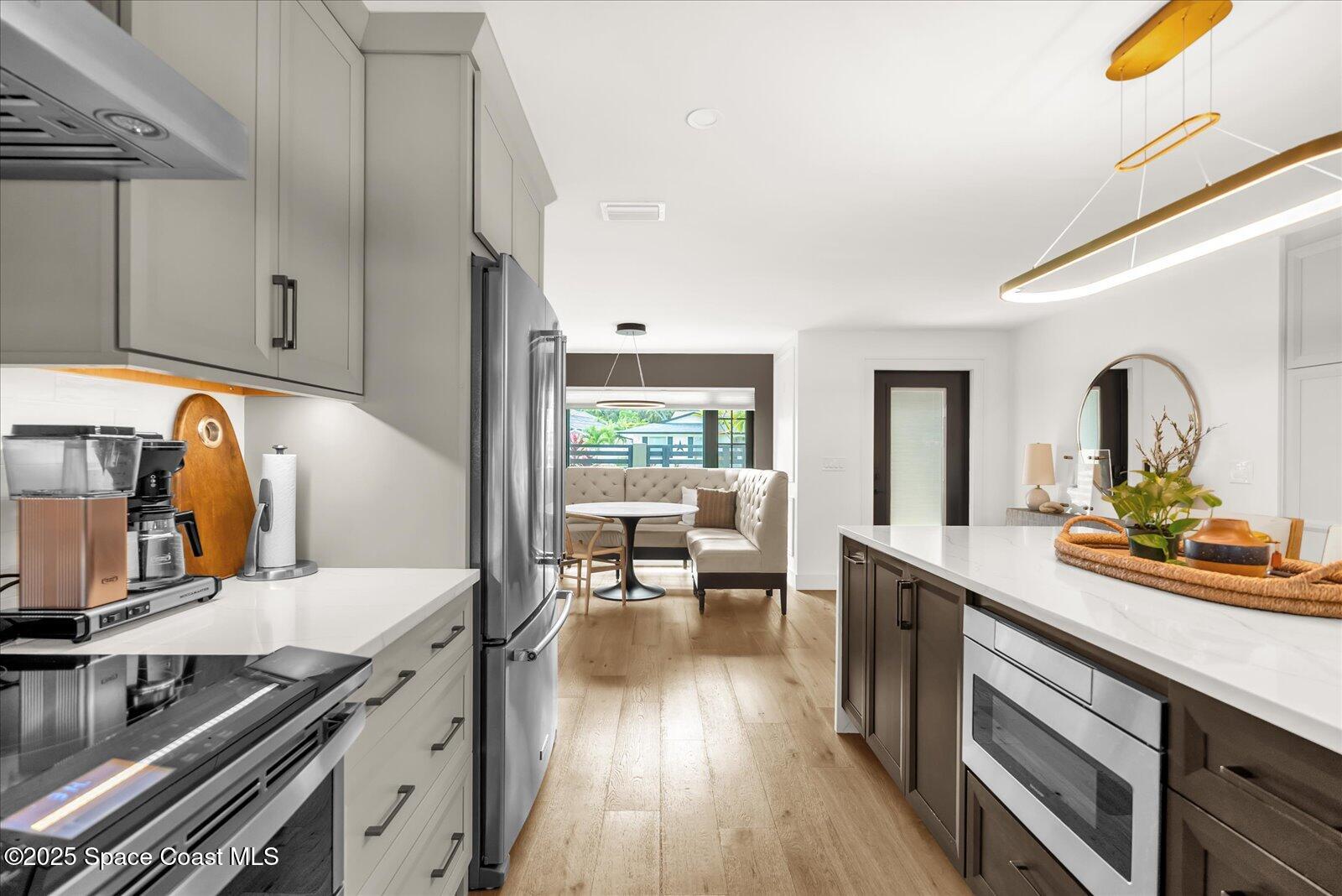 3204 Nottingham Lane Cocoa, FL 32926 - Photo 6 of 36 a kitchen with a sink stove and cabinets