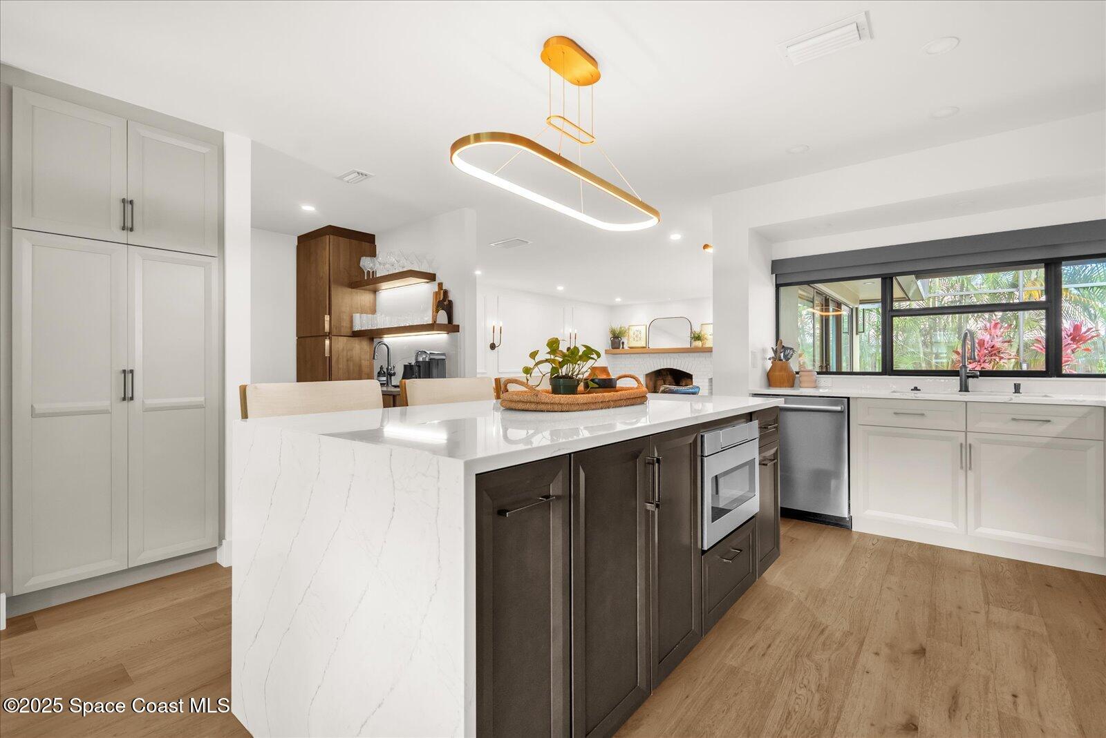 3204 Nottingham Lane Cocoa, FL 32926 - Photo 7 of 36 a kitchen with a sink cabinets and window