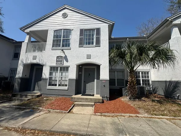 a front view of a house with a patio