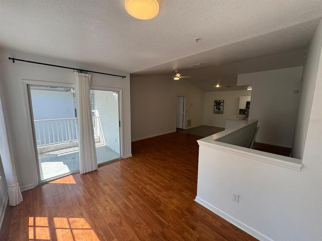 4320 South Kirkman Road, Unit 1508 Orlando, FL 32811 - Photo 6 of 25 a view of a kitchen with wooden floor and a sink