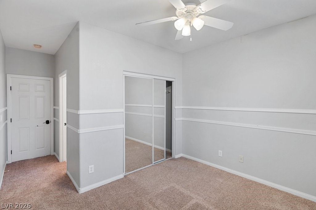 10336 Hawk Ravine Street Las Vegas, NV 89178 - Photo 38 of 59 This spacious bedroom offers ample natural light and a calming atmosphere.