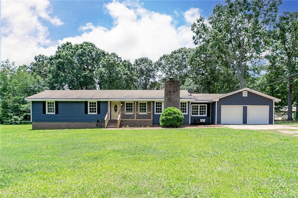 540 Richards Chapel Road Covington, GA 30016 - Photo 1 of 1 a view of a house with a yard and large trees