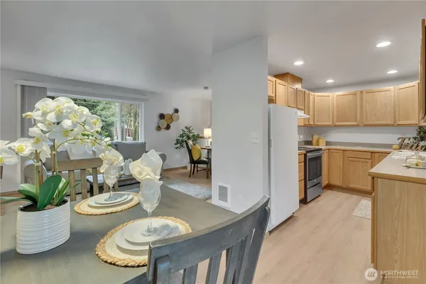 a kitchen with a table and chairs
