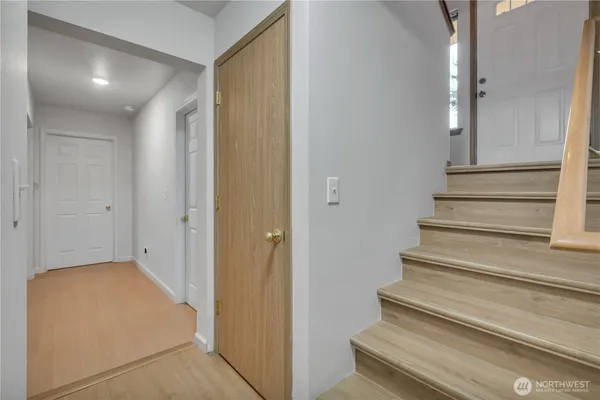 a view of entryway with wooden floor