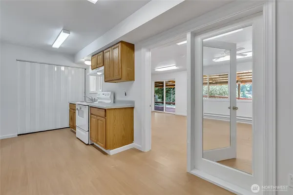 a view of a kitchen with a sink and a window