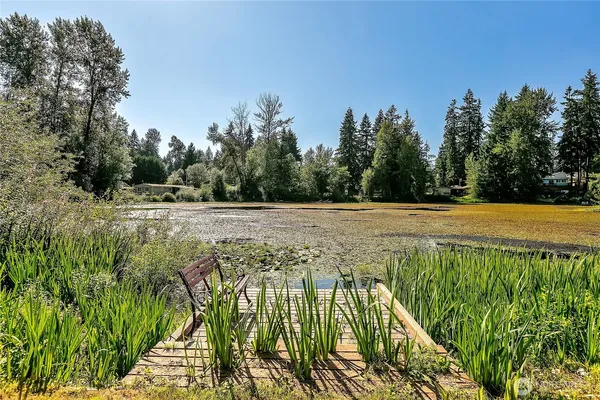 a view of a swimming pool with an outdoor space and seating area
