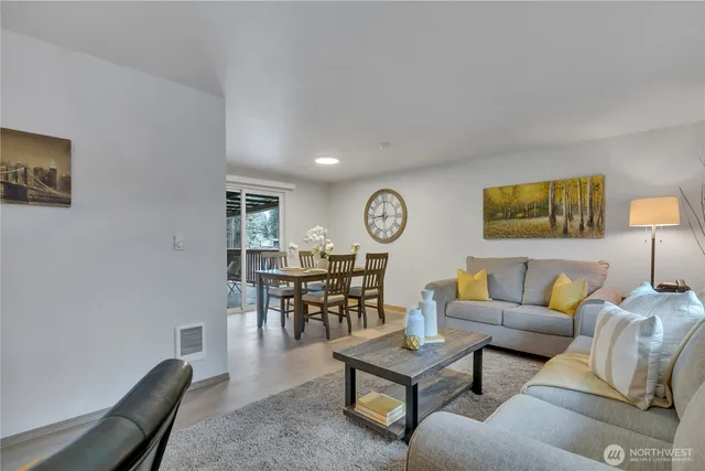 a living room with furniture and a table