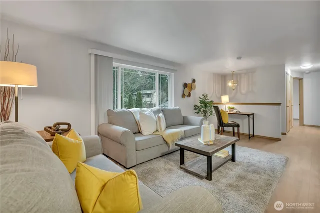 a living room with furniture and a table