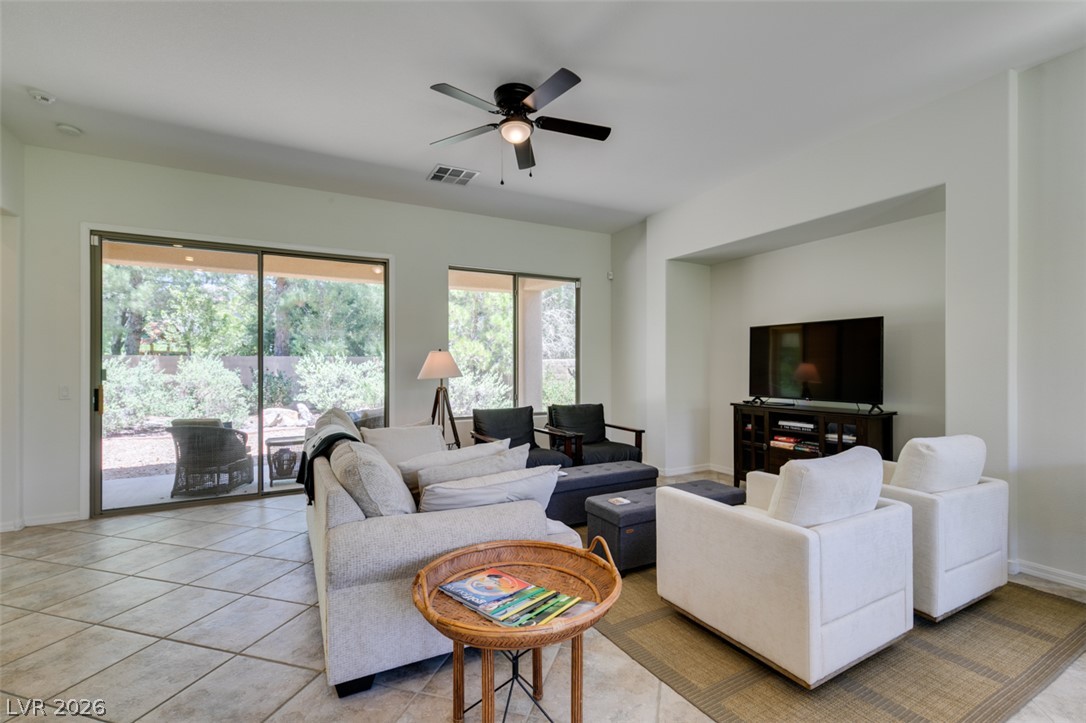 8 Kennesaw Road Henderson, NV 89052 - Photo 14 of 44 Naturally illuminated gathering space features ceramic tile flooring and direct patio access.