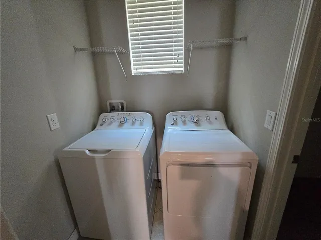 a utility room with dryer and washer