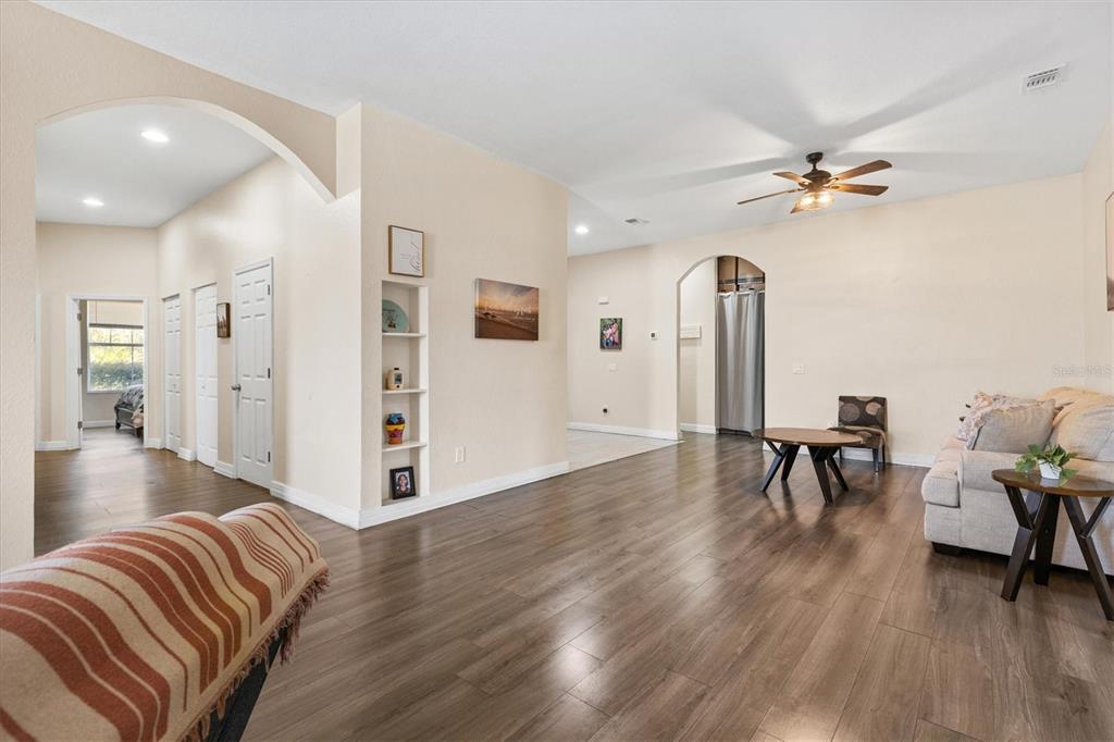 227 Locust Pass Course Ocala, FL 34472 - Photo 11 of 41 a view of livingroom with hardwood floor and a ceiling fan