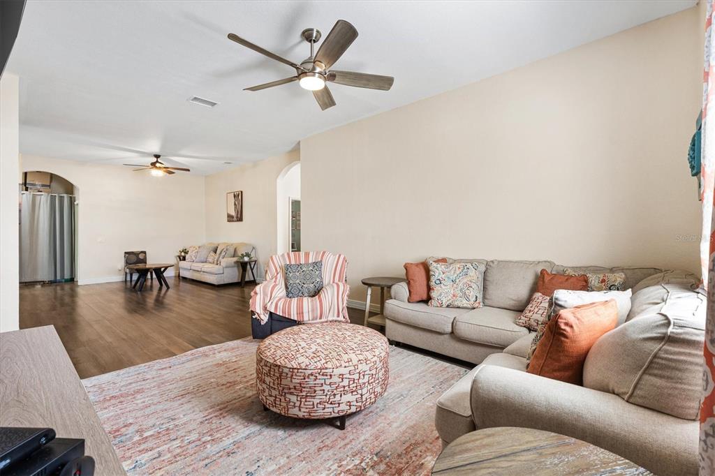 227 Locust Pass Course Ocala, FL 34472 - Photo 12 of 41 a living room with furniture and wooden floor
