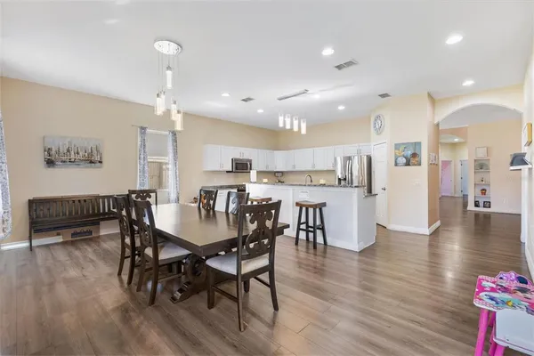 a view of a dining area with furniture and wooden floor