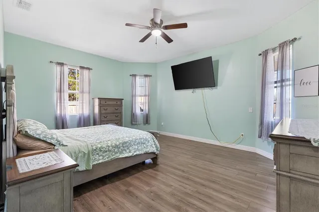 a bedroom with a bed and a dresser