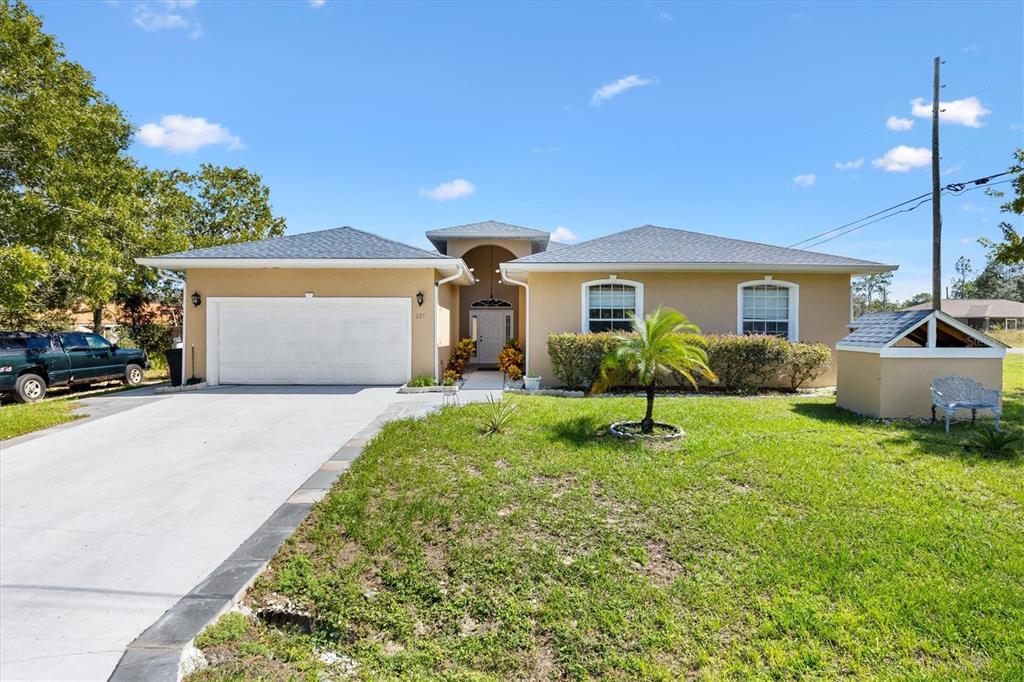 227 Locust Pass Course Ocala, FL 34472 - Photo 2 of 41 a view of outdoor space yard and garage