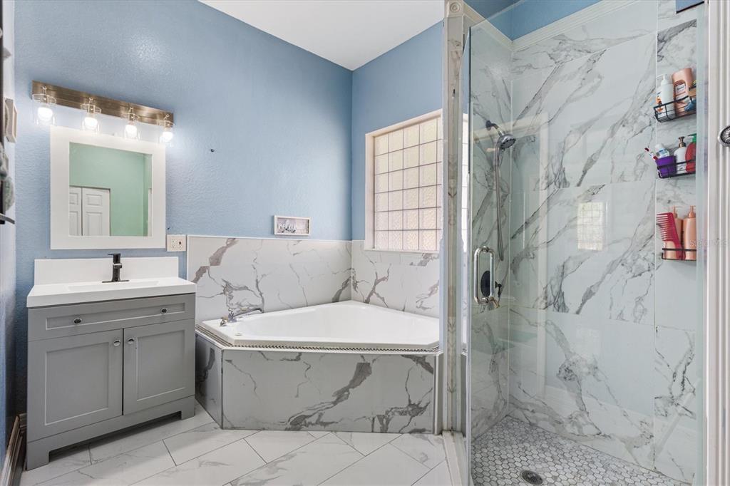 227 Locust Pass Course Ocala, FL 34472 - Photo 21 of 41 a bathroom with a sink toilet and shower