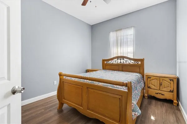 a bedroom with a bed and a dresser