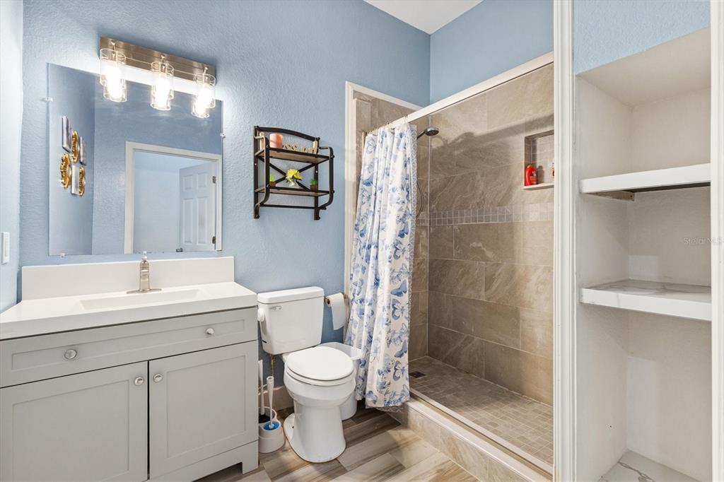 227 Locust Pass Course Ocala, FL 34472 - Photo 26 of 41 a bathroom with a toilet sink and shower