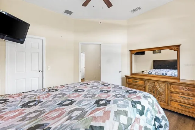 a bedroom with a bed and a dresser