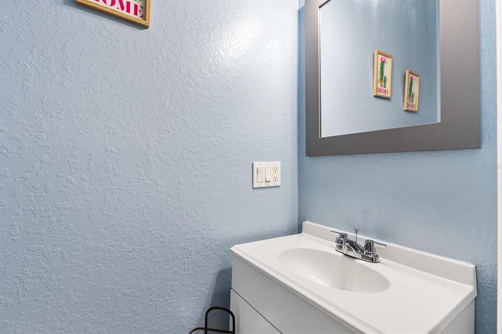 227 Locust Pass Course Ocala, FL 34472 - Photo 31 of 41 a bathroom with a sink and a mirror