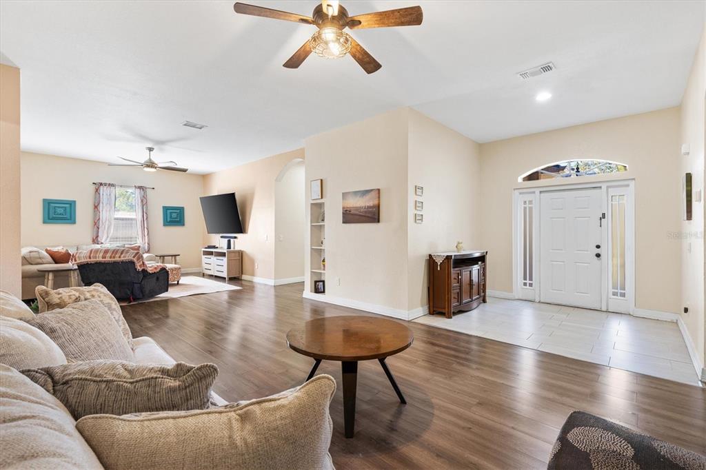 227 Locust Pass Course Ocala, FL 34472 - Photo 5 of 41 a living room with furniture and a wooden floor