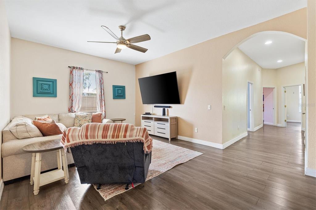 227 Locust Pass Course Ocala, FL 34472 - Photo 10 of 41 a living room with furniture and a flat screen tv