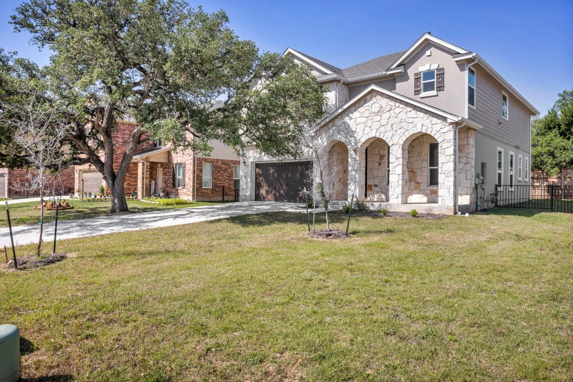 a view of a house with swimming pool and a yard