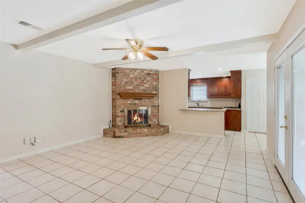 a view of kitchen with furniture wooden floor and window