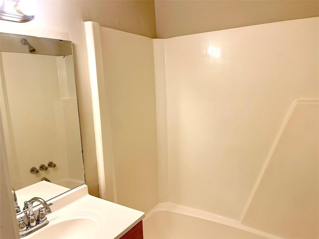 2611 Golfview Terrace Southeast Conyers, GA 30013 - Photo 11 of 22 a bathroom with a bathtub and shower