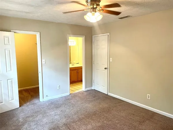an empty room with a bathroom