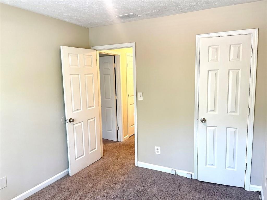 2611 Golfview Terrace Southeast Conyers, GA 30013 - Photo 14 of 22 an empty room with windows