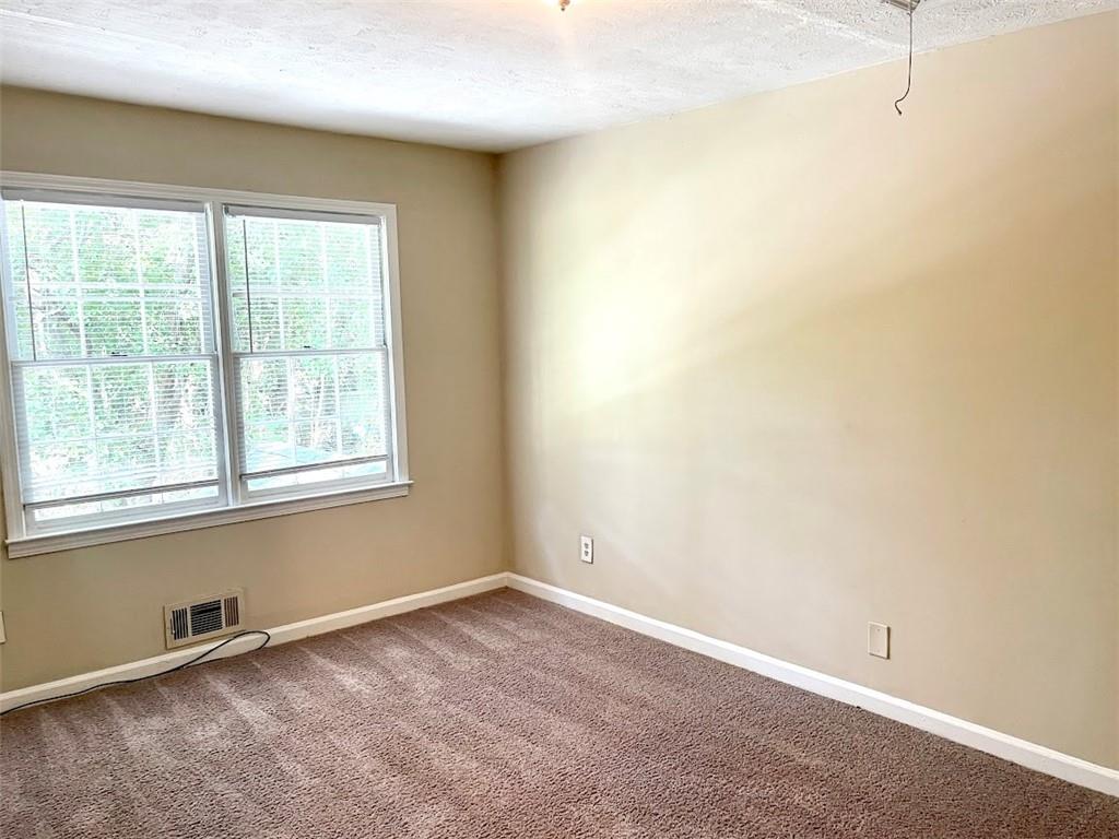 2611 Golfview Terrace Southeast Conyers, GA 30013 - Photo 15 of 22 an empty room with a window