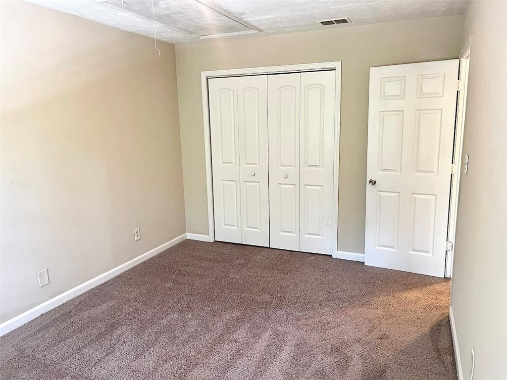 2611 Golfview Terrace Southeast Conyers, GA 30013 - Photo 16 of 22 an empty room with windows