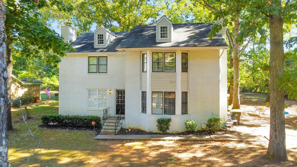 2611 Golfview Terrace Southeast Conyers, GA 30013 - Photo 20 of 22 a front view of a house with a yard