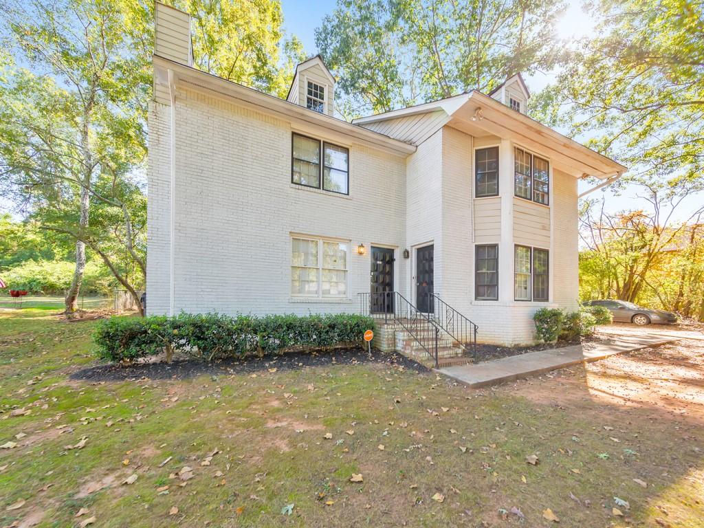 2611 Golfview Terrace Southeast Conyers, GA 30013 - Photo 2 of 22 a front view of a house with garden