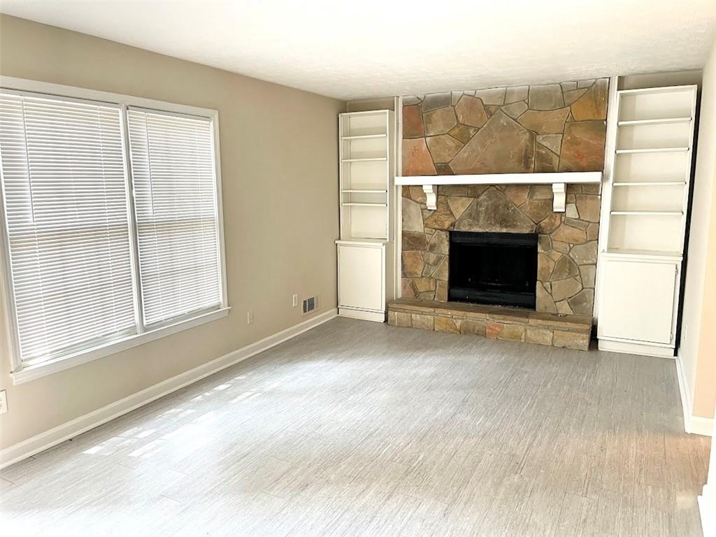 2611 Golfview Terrace Southeast Conyers, GA 30013 - Photo 4 of 22 a view of empty room with window and fireplace