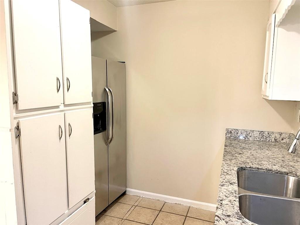 2611 Golfview Terrace Southeast Conyers, GA 30013 - Photo 8 of 22 a kitchen with a refrigerator and a stove