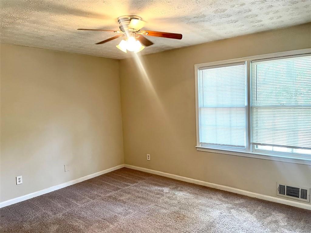 2611 Golfview Terrace Southeast Conyers, GA 30013 - Photo 10 of 22 an empty room with a window